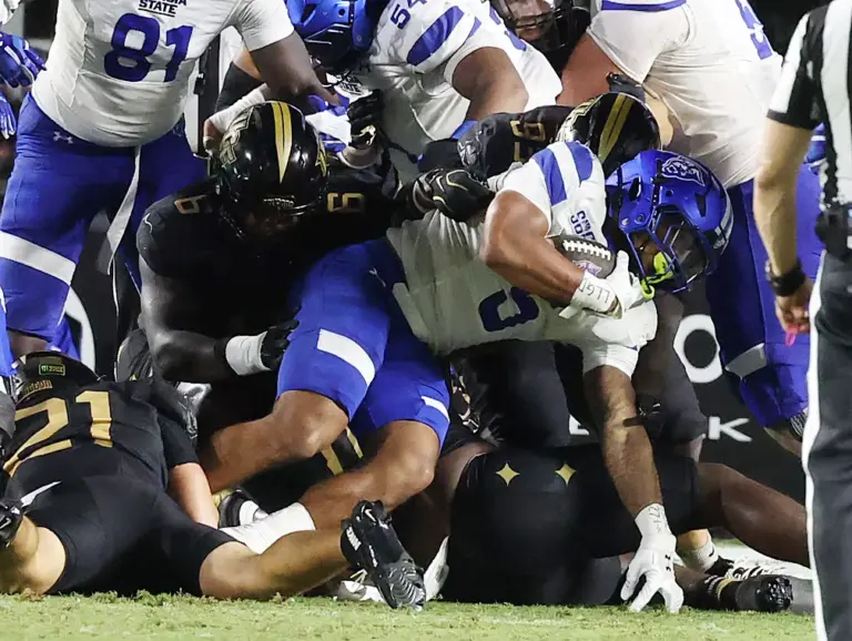 Georgia State running back Lanear McCrary (5) tries to fight...
