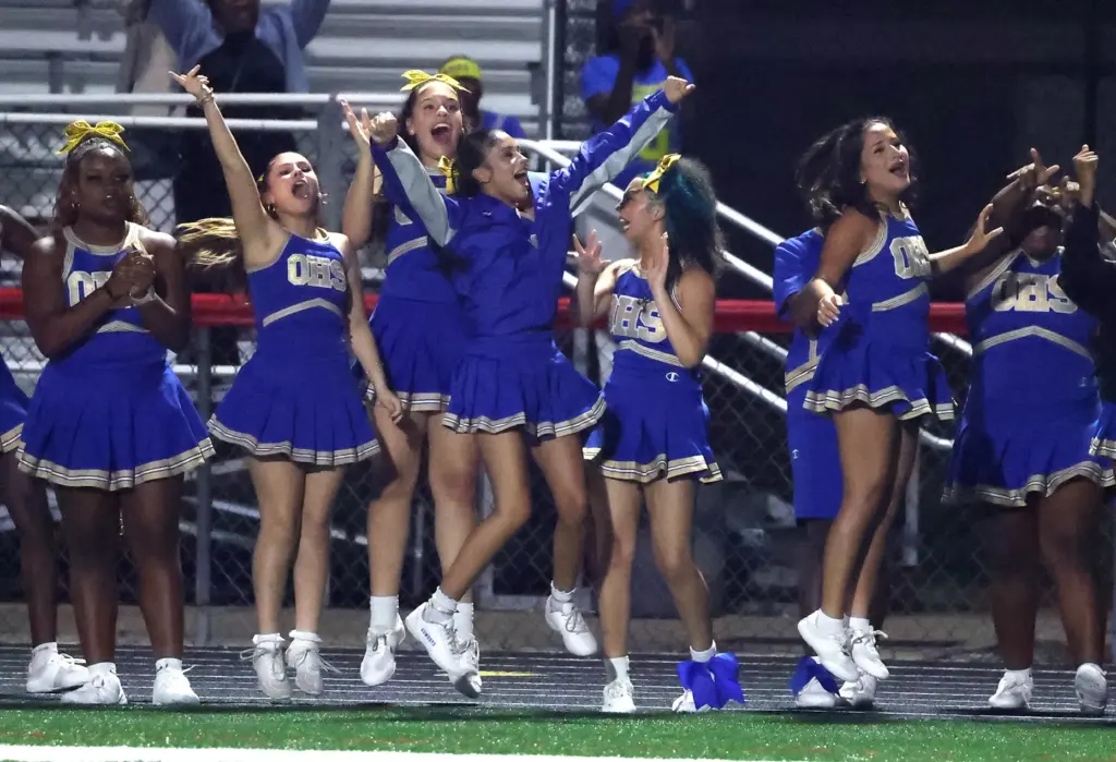 Osceola cheerleaders cheer during the Osceola High at Lake Mary...