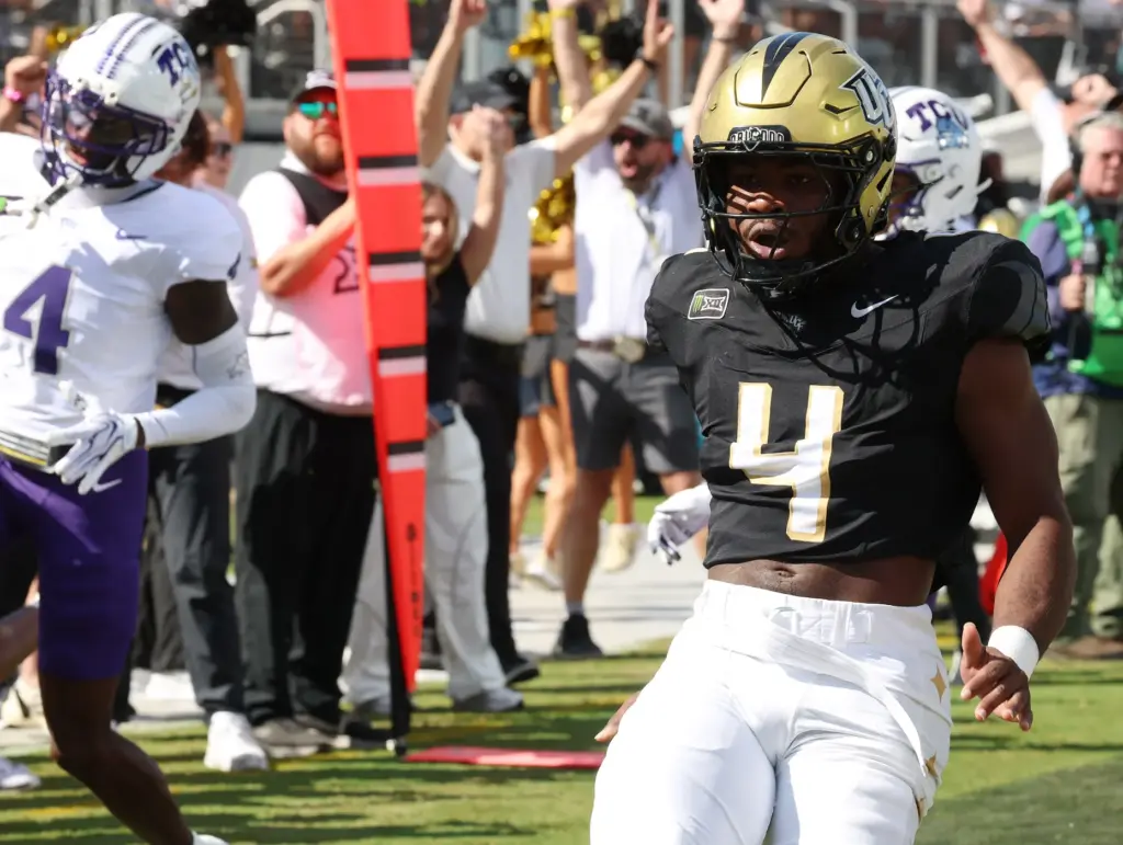 UCF running back Taevion Swint (4) celebrates after a touchdown...