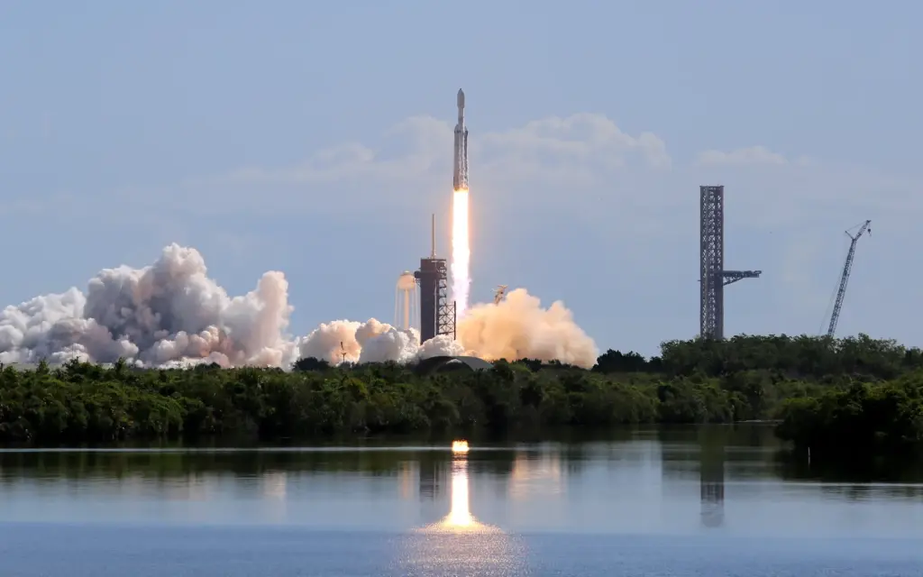 A SpaceX Falcon Heavy rocket launches from Kennedy Space Center's...