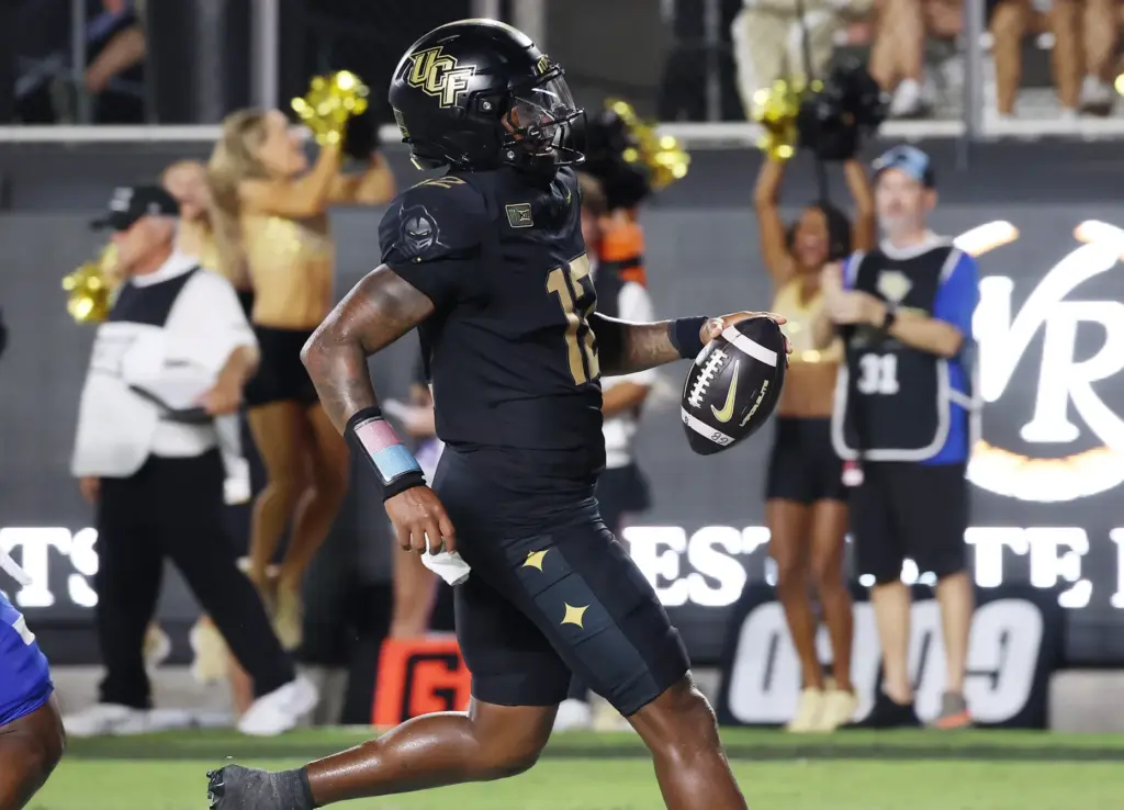 UCF quarterback Keyone Jenkins (12) runs for a touchdown during...
