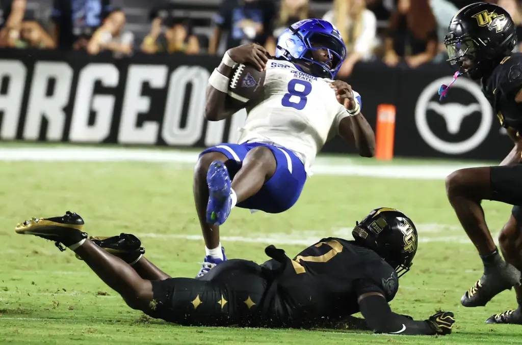 Georgia State quarterback Cameran Brown (8) leaps for a first...