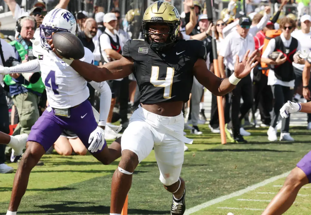 UCF running back Taevion Swint (4) celebrates as he scores...