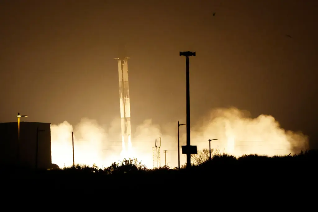 A SpaceX Falcon 9 rocket booster lands back on pad...