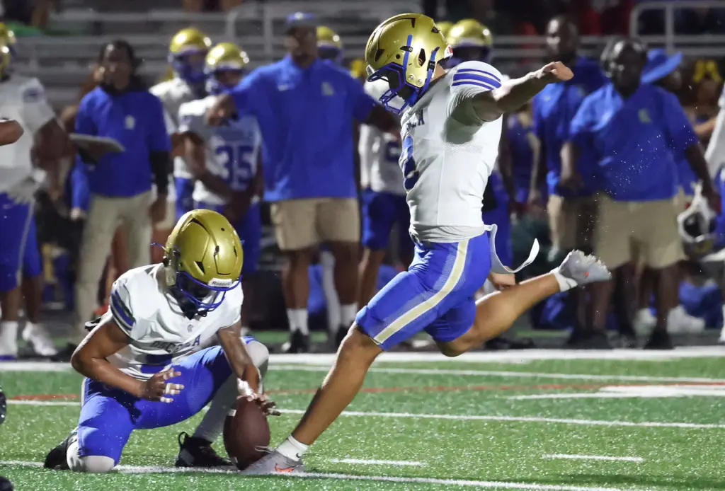 Osceola kicker Brayden Buehler kicks a field goal during the...