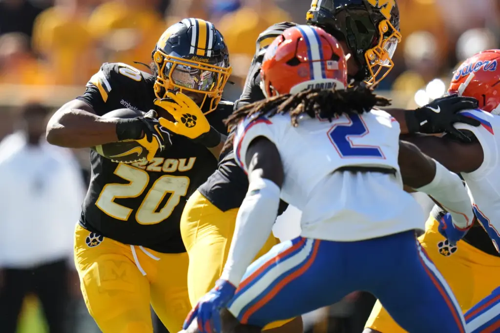 Missouri running back Jamal Roberts (20) runs with the ball...