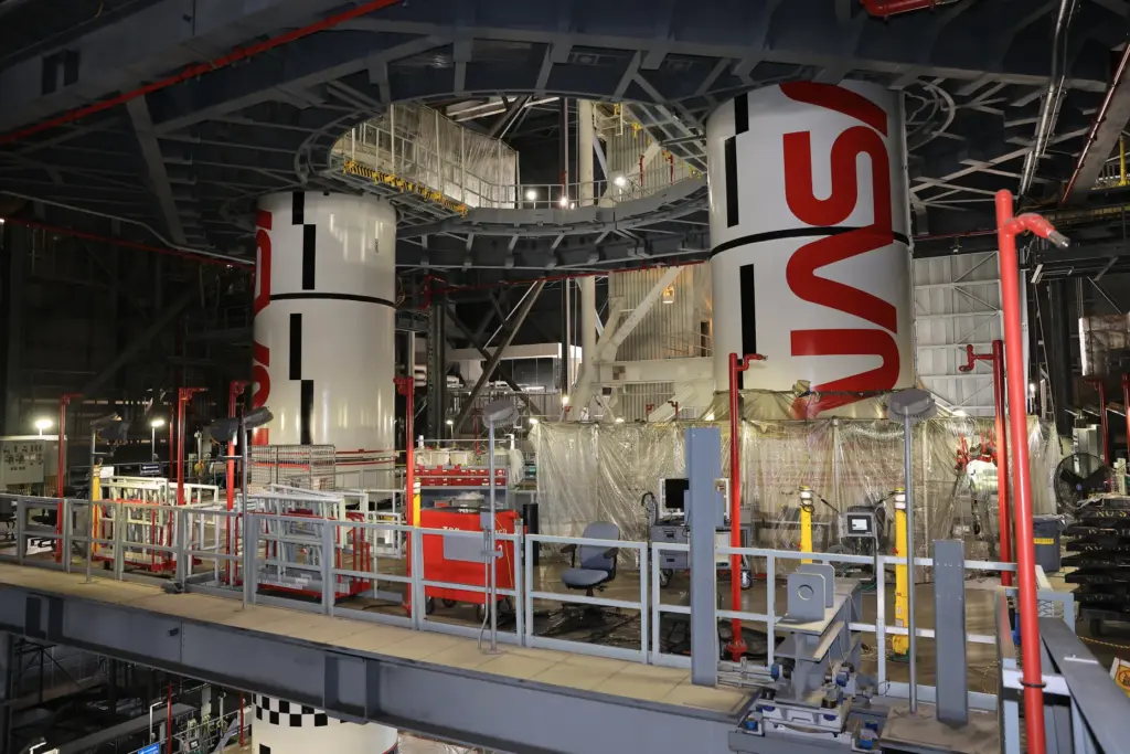 Technicians inside the Vehicle Assembly Building at NASA's Kennedy Space...