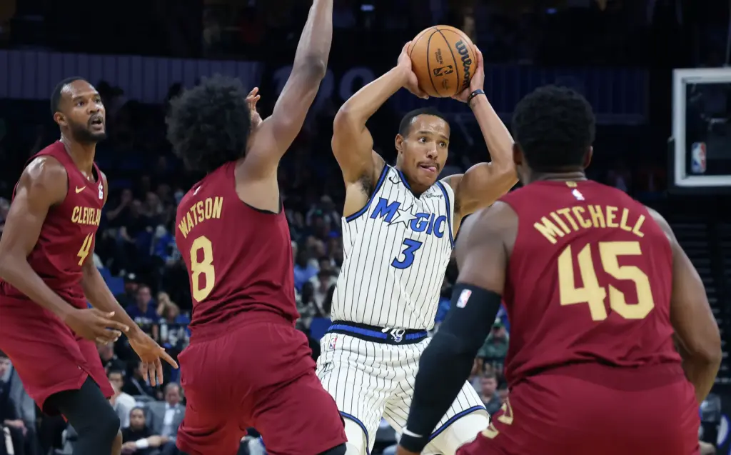 Orlando guard Desmond Bane (3) looks to pass among Cleveland...