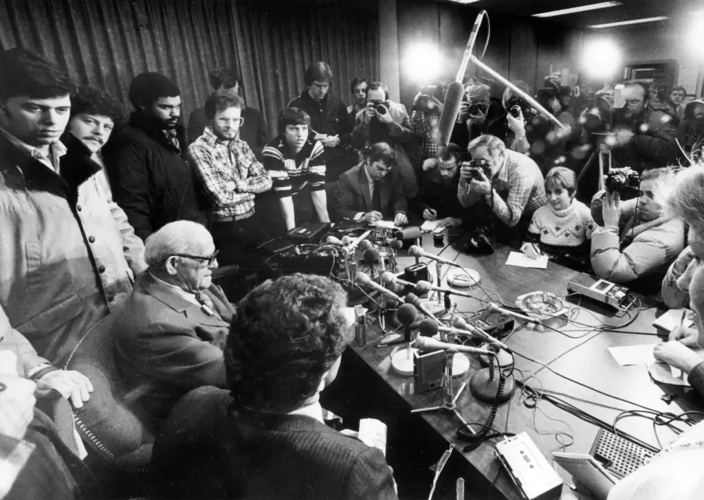 The press surrounds George Halas, lower left, as he announces...