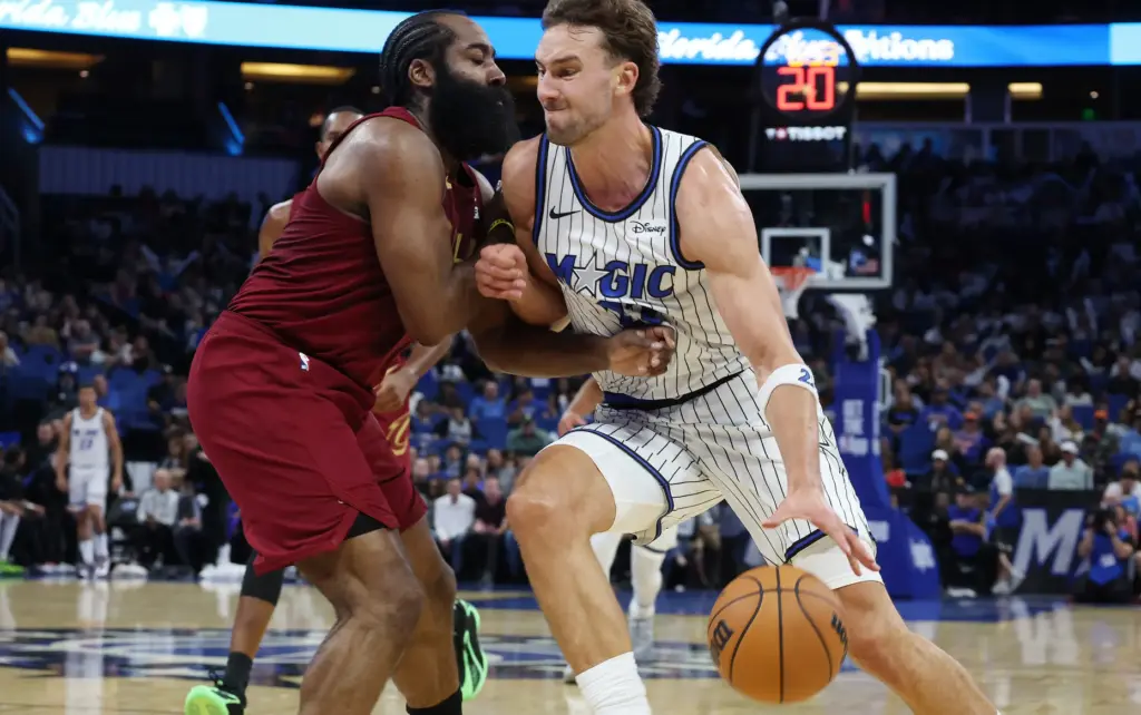 Orlando forward Franz Wagner (22) muscles his way past Cleveland guard James Harden (left) during the Cleveland Cavaliers at Orlando Magic NBA preseason game at the Kia Center in Orlando on Tuesday, October 13, 2026. (Stephen M. Dowell/Orlando Sentinel)
