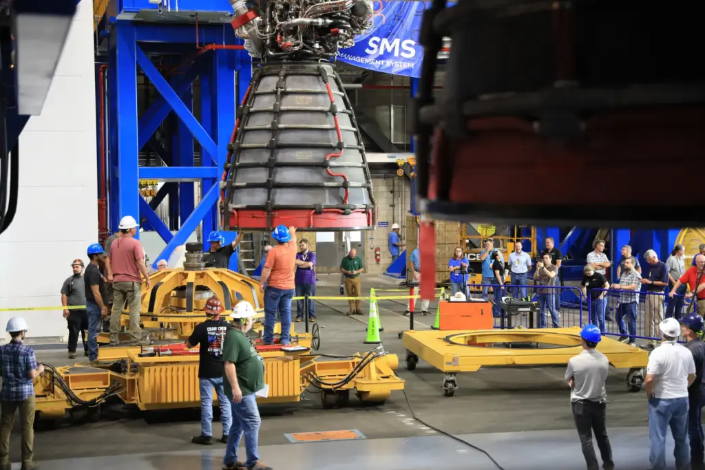 Technicians lift and transfer the #2 RS-25 SLS (Space Launch...