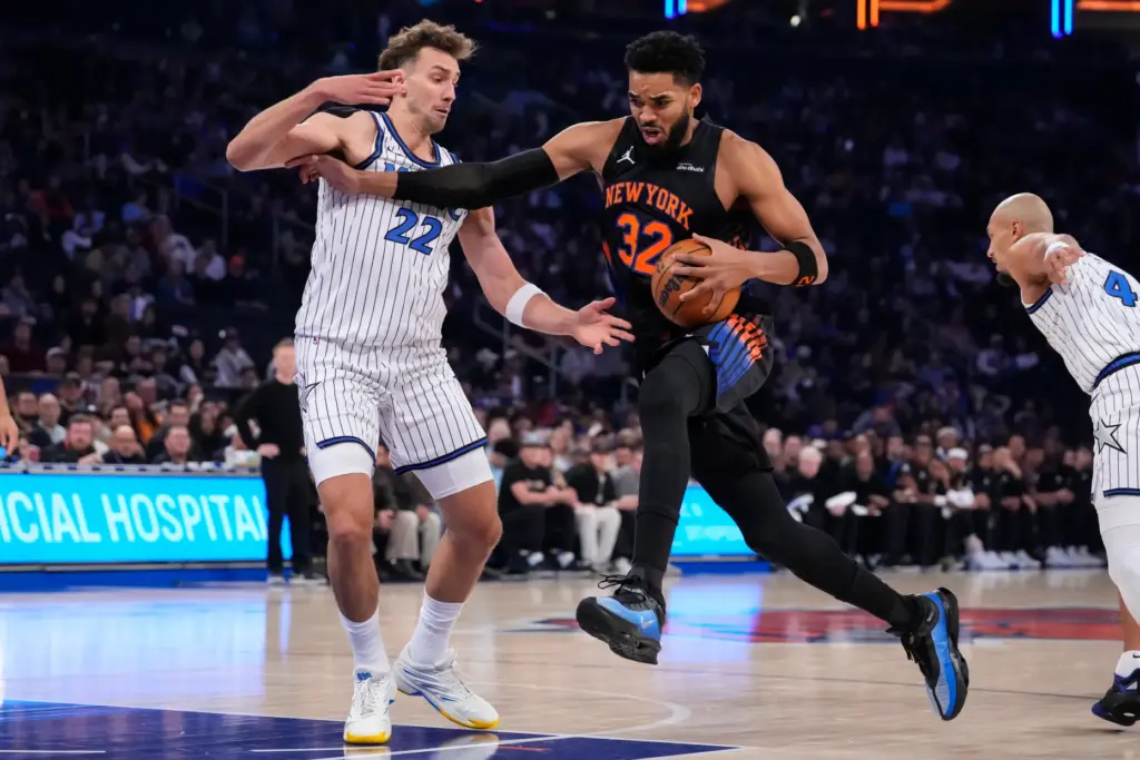 New York Knicks center Karl-Anthony Towns (32) drives past Orlando...