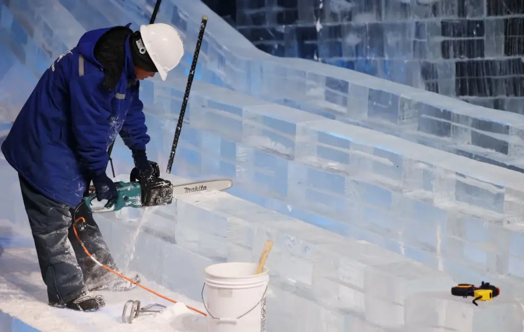 Master ice artisans from Harbin, China, at work during a...