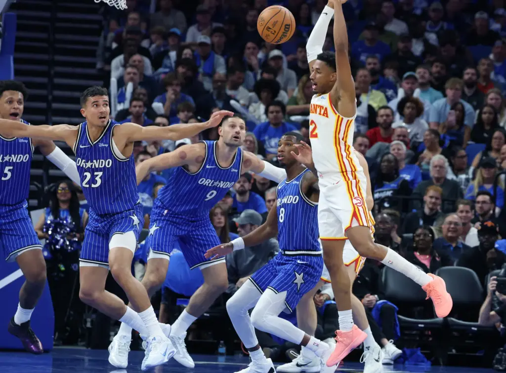 Atlanta guard Aaron Wiggins (2) loses the ball in front...