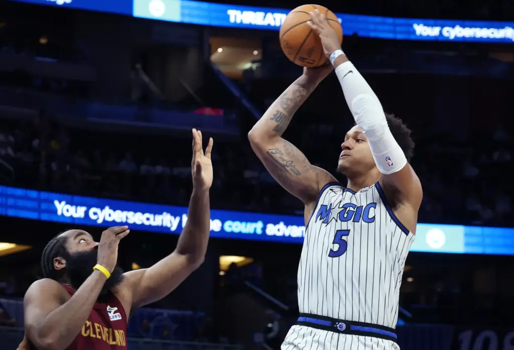 Orlando forward Paolo Banchero (5) shoots over Cleveland guard James...