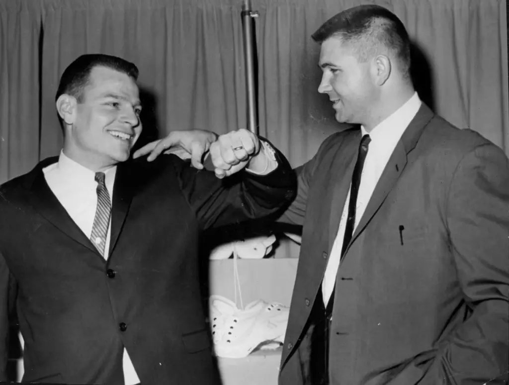 After the 1964 Bears season, Mike Ditka, right, and Johnny...