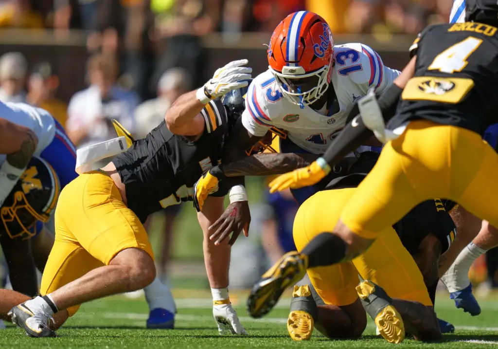 Florida running back Jadan Baugh (13) is kept out of the end zone by Missouri linebacker Nicholas Rodriguez during the Gators' 45-17 loss Saturday in Columbia, Missouri. (AP Photo/Jeff Roberson)