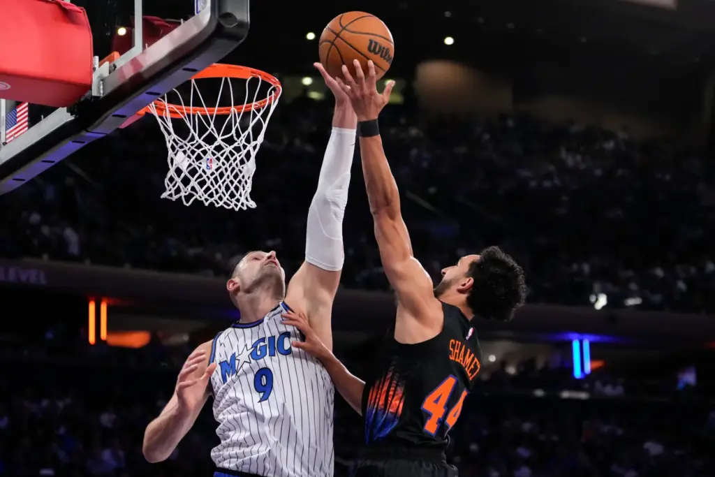Orlando Magic center Nikola Vucevic (9) blocks New York Knicks...