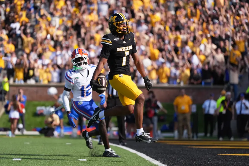 Missouri wide receiver Donovan Olugbode (1) scores past Florida cornerback...