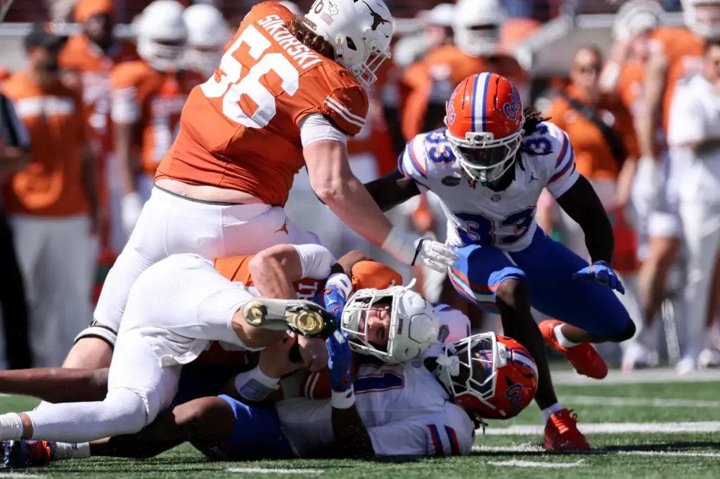 LJ McCray of the Florida Gators sacks Arch Manning of...