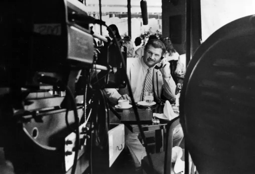 Bears coach Mike Ditka films a commercial for Midway Airlines...