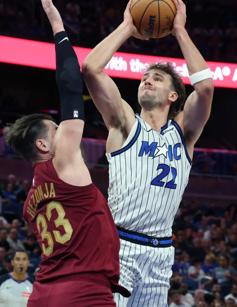 Orlando forward Franz Wagner (22) shoots over Cleveland forward Mario...