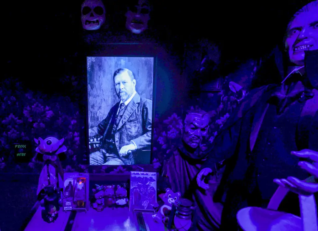 A portrait of horror author Bram Stoker looks over a...