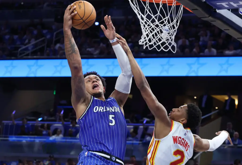 Orlando forward Paolo Banchero (5) scores past Atlanta guard Aaron...