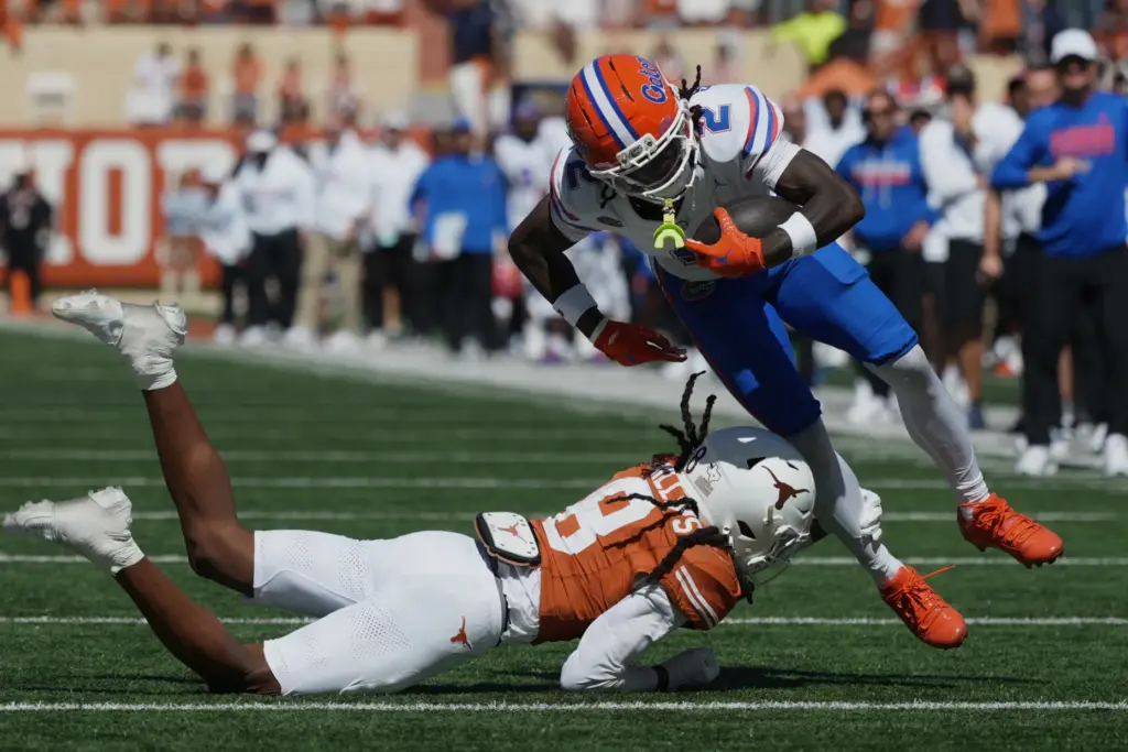 Florida wide receiver Eric Singleton Jr. (2) is upended by...