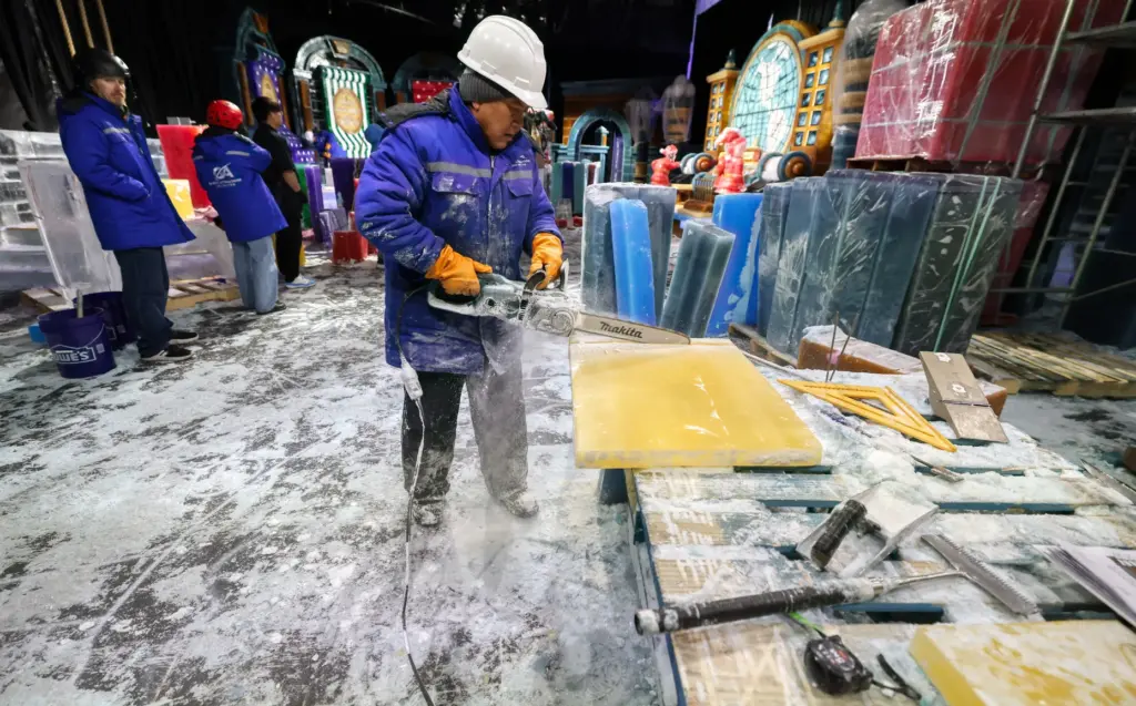 Master ice artisans from Harbin, China, at work during a...