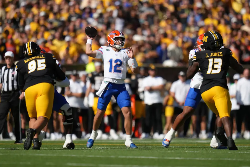 Florida quarterback Aaron Philo (12) throws during the first half...