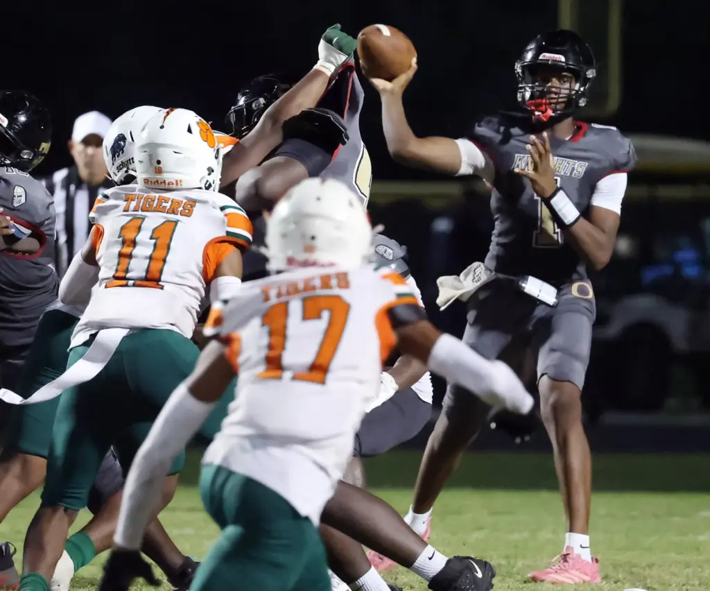 Ocoee High quarterback Nathaniel Watkins (1) throws over the Jones...