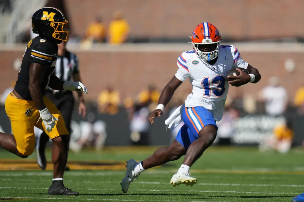 Florida running back Jadan Baugh (13) runs with the ball...