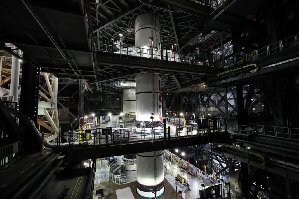 Technicians inside the Vehicle Assembly Building at NASA's Kennedy Space...