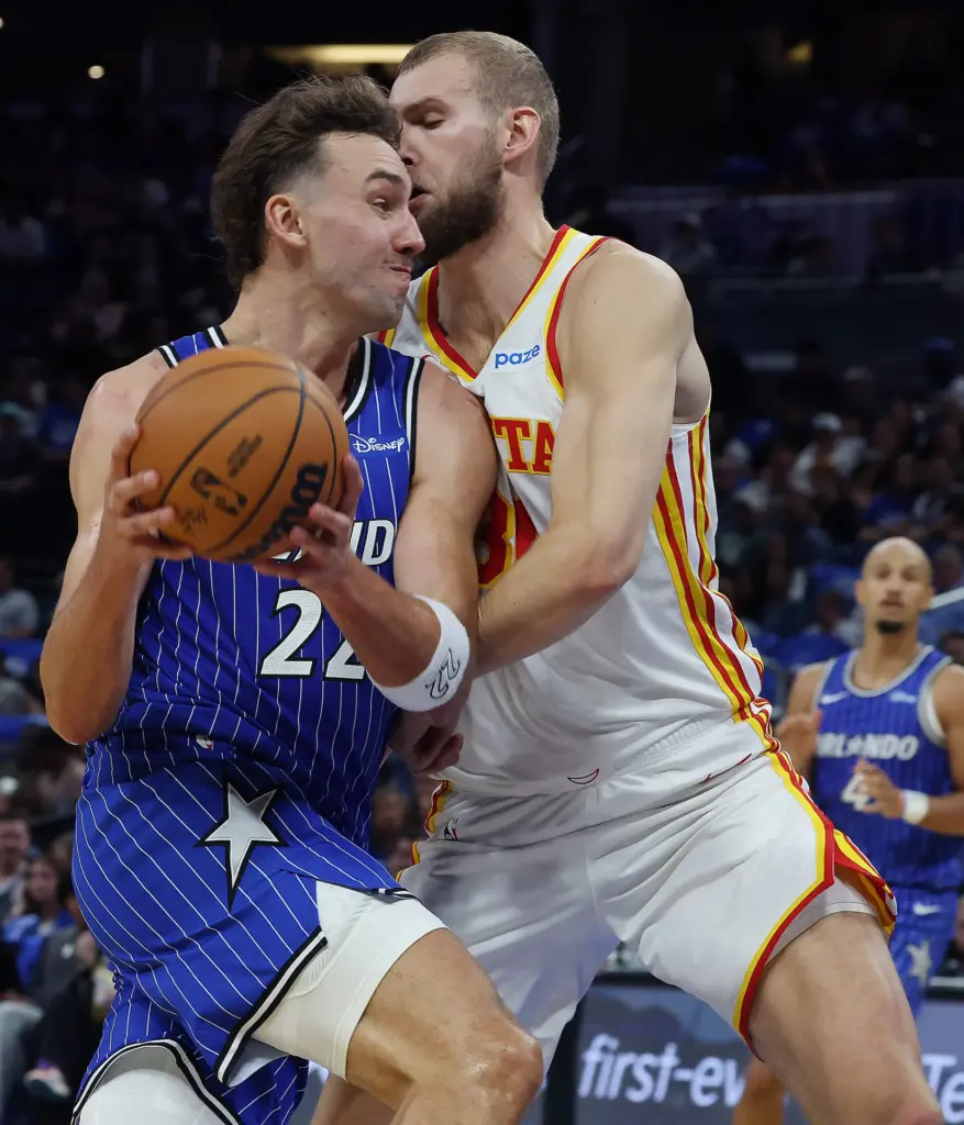 Orlando forward Franz Wagner (22) drives into Atlanta center Jock...