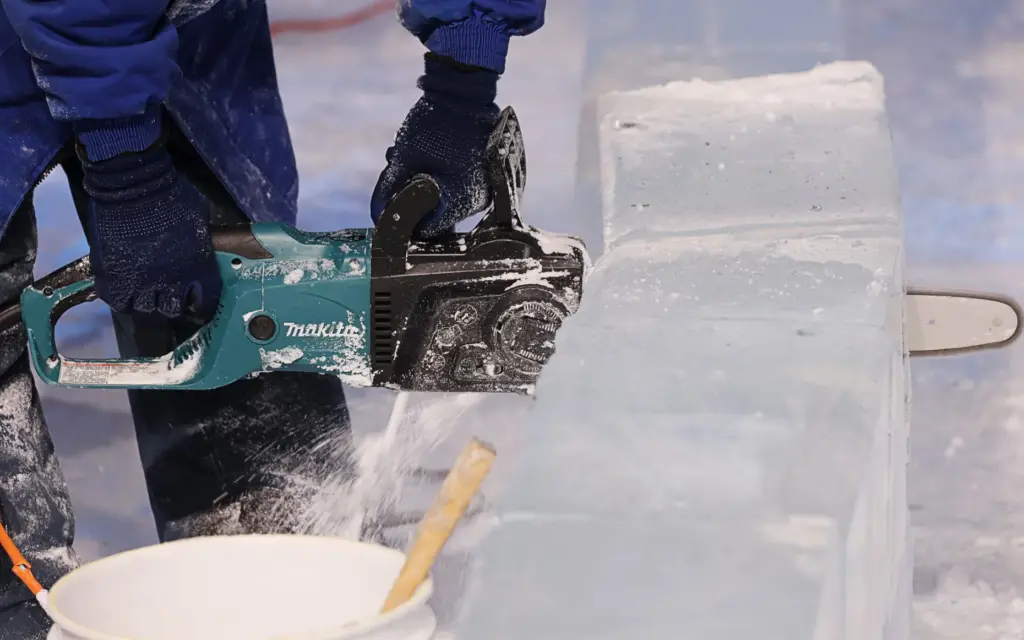 Master ice artisans from Harbin, China, at work during a...