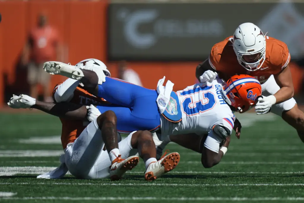Florida running back Jadan Baugh (13) is stopped by Texas...