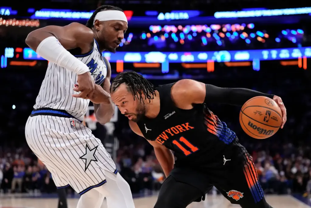 New York Knicks guard Jalen Brunson (11) drives past Orlando...
