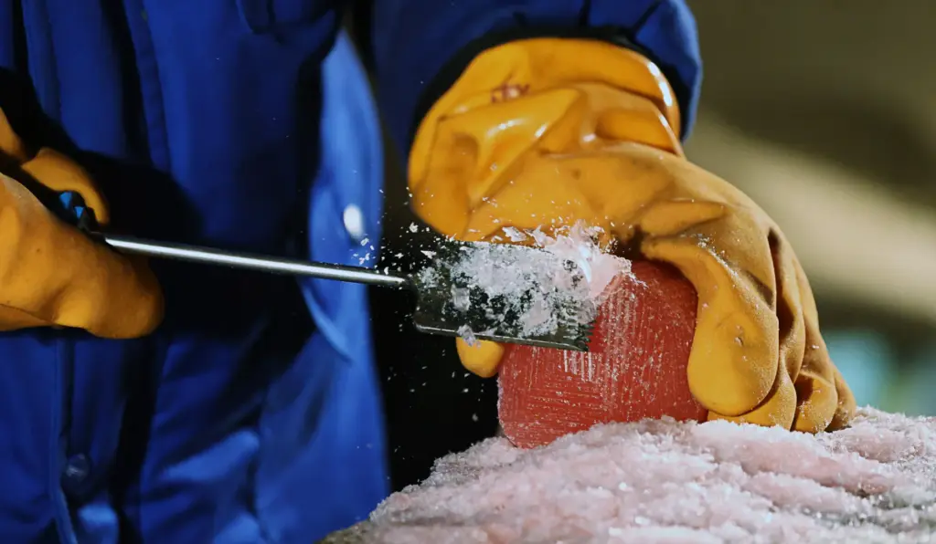 Master ice artisans from Harbin, China, at work during a...