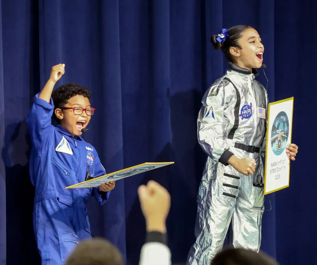 Kindergartner Lennon Hughes and fifth-grader Myla Oliveria, students in Sally...