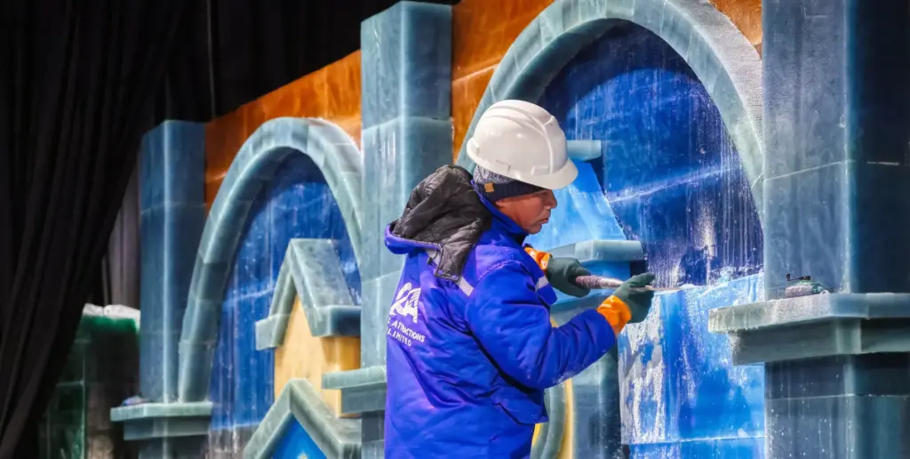Master ice artisans from Harbin, China, at work during a...