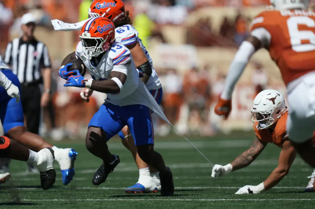 Florida running back Jadan Baugh (13) runs against Texas during...