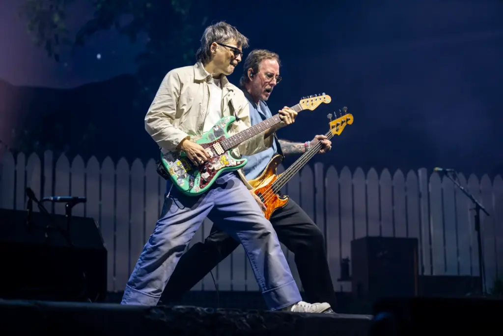 Weezer frontman Rivers Cuomo and bassist Scott Shriner share a moment on stage while performing at Kia Center on âThe Gatheringâ tour in Orlando on Sunday night. (Patrick Connolly/Orlando Sentinel)