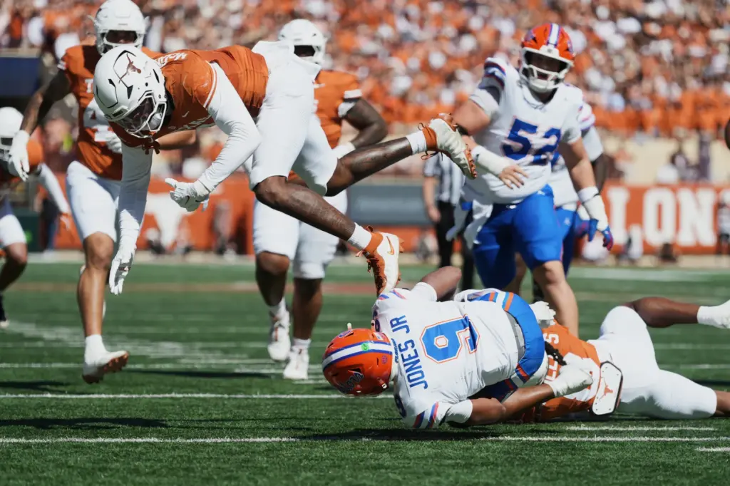 Florida quarterback Tramell Jones Jr. (9) is knocked down by...