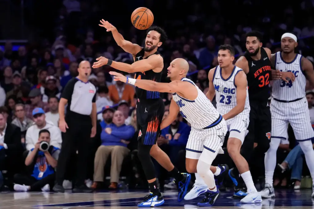New York Knicks guard Landry Shamet (44), center left, fights...